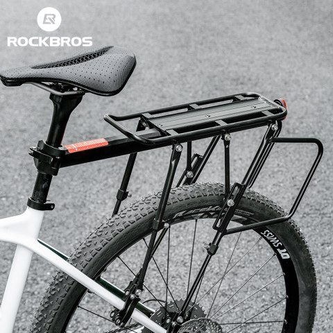 Wytrzymały bagażnik rowerowy z półką i funkcją siodełka i lampką tylną LED czarny Wytrzymały bagażnik rowerowy z półką i funkcją siodełka i lampką tylną LED czarny